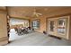 Covered patio featuring a seating area, ceiling fans, and easy access to indoor spaces at 1211 Bourbon St, Pahrump, NV 89048