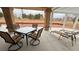 Relaxing covered patio featuring stylish outdoor furniture and a view at 1211 Bourbon St, Pahrump, NV 89048