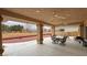 The covered patio boasts two fans, outdoor dining area and ample space at 1211 Bourbon St, Pahrump, NV 89048
