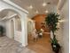 Bright dining area featuring arched entryways, hardwood floors, and modern décor and dining set at 1211 Bourbon St, Pahrump, NV 89048
