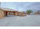 Wide driveway with covered area connecting the house and detached garage at 1211 Bourbon St, Pahrump, NV 89048