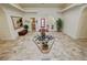Spacious foyer featuring a central mermaid fountain, tile flooring, neutral walls, and an open layout at 1211 Bourbon St, Pahrump, NV 89048