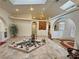 Bright foyer with a mermaid statue fountain, skylights, arched doorways, and easy access to other areas at 1211 Bourbon St, Pahrump, NV 89048
