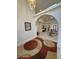 Elegant foyer features a high ceiling, modern light fixture, and unique arched entryway at 1211 Bourbon St, Pahrump, NV 89048
