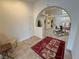 Spacious foyer with arched doorways and tiled floors leading to living areas at 1211 Bourbon St, Pahrump, NV 89048