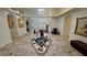 Grand foyer features a central mermaid statue, tile flooring, arched doorways, and abundant natural light from the skylights at 1211 Bourbon St, Pahrump, NV 89048