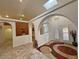 Foyer features arched doorways, unique mermaid water feature, and seamlessly connects to the living spaces at 1211 Bourbon St, Pahrump, NV 89048