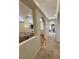 Hallway with arched openings leading to the dining room and other rooms at 1211 Bourbon St, Pahrump, NV 89048