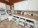 Well-appointed kitchen with custom pull-out drawers, granite countertops, and stainless steel appliances at 1211 Bourbon St, Pahrump, NV 89048
