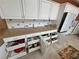 This well-organized kitchen features custom pull-out drawers, granite countertops, and modern stainless steel appliances at 1211 Bourbon St, Pahrump, NV 89048