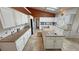 Large kitchen featuring white cabinets, an island with a sink, and tiled floors at 1211 Bourbon St, Pahrump, NV 89048