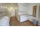 Well-equipped laundry room with plenty of storage, a sink, and pull-out ironing board at 1211 Bourbon St, Pahrump, NV 89048