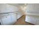 Laundry area featuring modern washer and dryer with ample storage and white cabinetry at 1211 Bourbon St, Pahrump, NV 89048