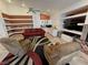 Open concept living area with a wet bar, built-in shelving, and comfortable seating at 1211 Bourbon St, Pahrump, NV 89048