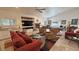 Spacious living room with comfortable seating, fireplace, and a pool table for entertainment at 1211 Bourbon St, Pahrump, NV 89048