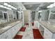 Main bathroom featuring granite counters, white cabinetry, and tile flooring at 1211 Bourbon St, Pahrump, NV 89048