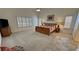 Large main bedroom offers plantation shutters, a ceiling fan and carpet floors at 1211 Bourbon St, Pahrump, NV 89048