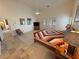 Main bedroom offers carpet floors, ceiling fan, and large bed at 1211 Bourbon St, Pahrump, NV 89048