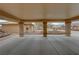 Spacious covered patio showing desert landscaping and access to the yard at 1211 Bourbon St, Pahrump, NV 89048