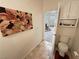 Powder room view near the home's entry featuring unique art and fixtures for guests at 1211 Bourbon St, Pahrump, NV 89048