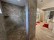 Shower with neutral tile and glass wall provides an open, airy feel at 1211 Bourbon St, Pahrump, NV 89048