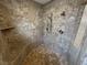 Shower boasts neutral tile work and a convenient built-in shower seat at 1211 Bourbon St, Pahrump, NV 89048