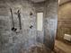 Elegant tiled shower with a built in niche and rain shower head at 1211 Bourbon St, Pahrump, NV 89048
