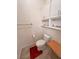 Toilet area with white cabinetry and granite countertop at 1211 Bourbon St, Pahrump, NV 89048