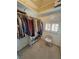 Organized walk-in closet with natural light. Custom shelves for ample storage at 1211 Bourbon St, Pahrump, NV 89048
