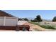 Large lot is surrounded by a white fence and mountains are visible in the distance at 1211 Bourbon St, Pahrump, NV 89048