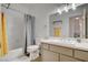 Clean bathroom showcasing a toilet, sink, and shower with neutral finishes and updated lighting at 1401 Red Crest Ln # 201, Las Vegas, NV 89144