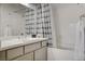 Bright bathroom featuring a shower-tub combo with a white vanity and modern fixtures at 1401 Red Crest Ln # 201, Las Vegas, NV 89144