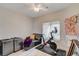 Cozy bedroom with a Peloton bike, small couch, and artwork; a perfect workout space at 1401 Red Crest Ln # 201, Las Vegas, NV 89144