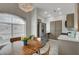 Well-lit dining area next to a modern kitchen with stainless steel appliances at 1401 Red Crest Ln # 201, Las Vegas, NV 89144