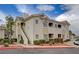 Attractive condo featuring two-story design, well-maintained landscaping, and a welcoming entrance at 1401 Red Crest Ln # 201, Las Vegas, NV 89144