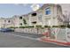 Apartment building with balconies, clearly visible unit numbers and rock wall landscaping at 1401 Red Crest Ln # 201, Las Vegas, NV 89144