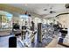 Well-equipped fitness center with various exercise machines and ample natural light at 1401 Red Crest Ln # 201, Las Vegas, NV 89144