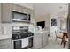 Modern kitchen with stainless steel range hood, and oven at 1401 Red Crest Ln # 201, Las Vegas, NV 89144