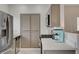 Modern kitchen with stainless steel appliances, light countertops, and light cabinets at 1401 Red Crest Ln # 201, Las Vegas, NV 89144