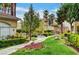 Beautifully landscaped walkway lined with flowers and trees; a serene environment at 1401 Red Crest Ln # 201, Las Vegas, NV 89144