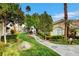 Scenic view of a landscaped walkway with lush greenery, ideal for a relaxing stroll at 1401 Red Crest Ln # 201, Las Vegas, NV 89144