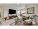 Cozy living room with a large TV, stylish furnishings, and an open layout at 1401 Red Crest Ln # 201, Las Vegas, NV 89144