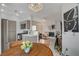 Open-concept living space featuring a kitchen, dining area, and fireplace at 1401 Red Crest Ln # 201, Las Vegas, NV 89144