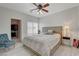 Light filled main bedroom with large bed, ceiling fan, and walk-in closet at 1401 Red Crest Ln # 201, Las Vegas, NV 89144
