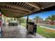 Enjoy the backyard featuring a covered patio, large grill, and a refreshing swimming pool at 1580 Rosita Dr, Las Vegas, NV 89123