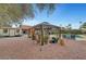 A serene backyard features a shaded pergola, pool, and ample lounge seating at 1580 Rosita Dr, Las Vegas, NV 89123