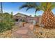 A desert landscaped backyard showing a stone path, succulent garden, and privacy wall at 1580 Rosita Dr, Las Vegas, NV 89123
