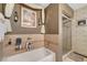 Bathroom featuring a bathtub with shower and designer-inspired finishes at 1580 Rosita Dr, Las Vegas, NV 89123