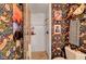 This full bath features colorful wallpaper, a stylish mirror, and a tiled shower at 1580 Rosita Dr, Las Vegas, NV 89123