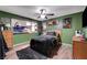 Cozy bedroom with an aquarium, ceiling fan, and natural light from the window at 1580 Rosita Dr, Las Vegas, NV 89123